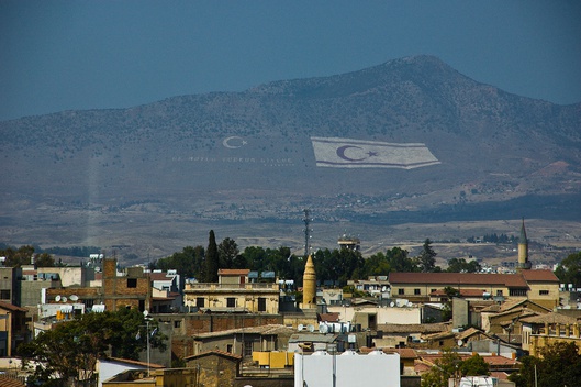 The Turkish flag flies in the north of the island