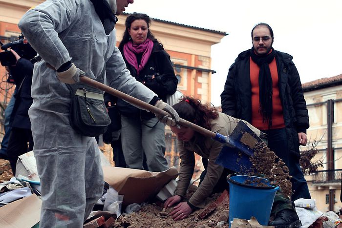 Image for L’Aquila post-earthquake: wheelbarrow people clean up themselves